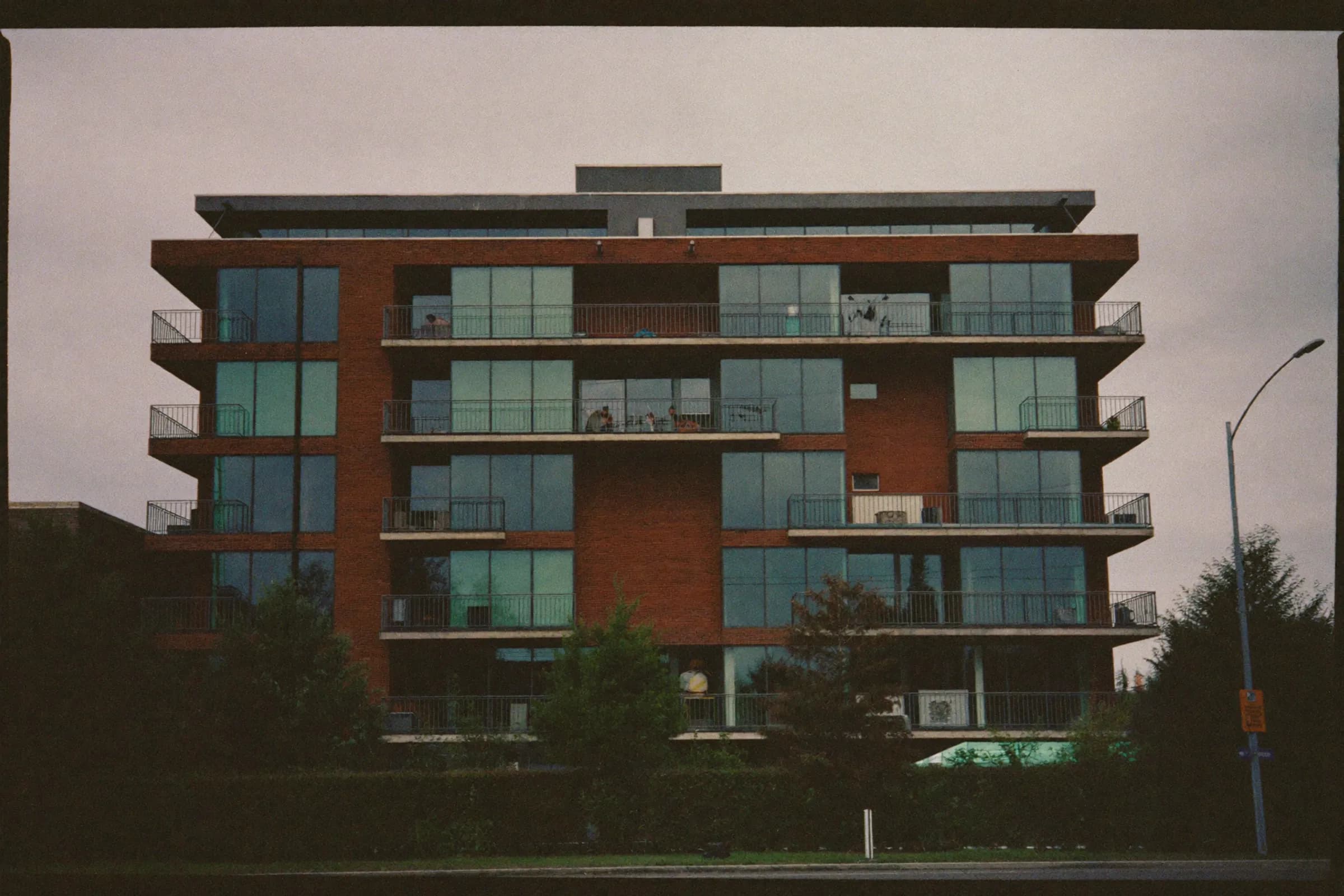 A modern brick and glass apartment building